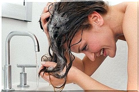 Woman washes hair