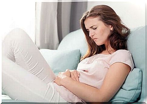 Woman with stomachache on the couch