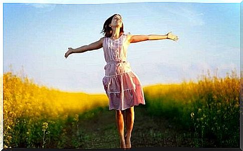 Cheerful woman in a meadow