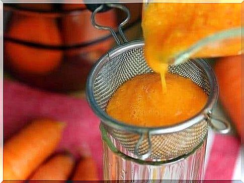 Carrot syrup through a sieve