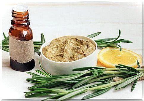 Bottle of rosemary oil and a brown rosemary ointment