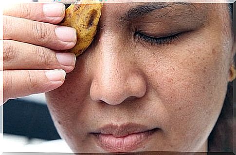 Woman with banana peel against the eye