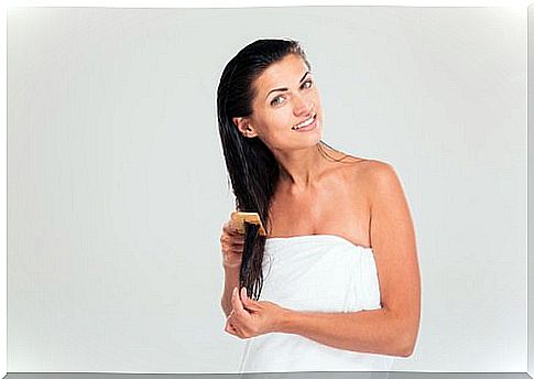 Woman taking care of her hair to prevent split ends