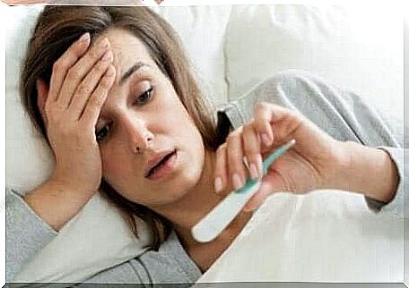 A woman in bed with a fever