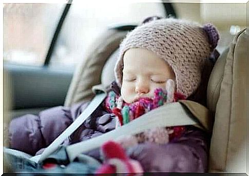 Sleeping baby in a car seat