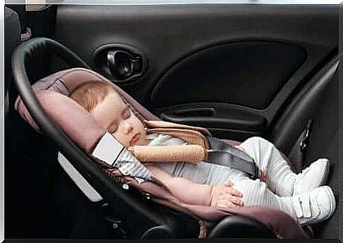 Baby is sleeping in a car seat